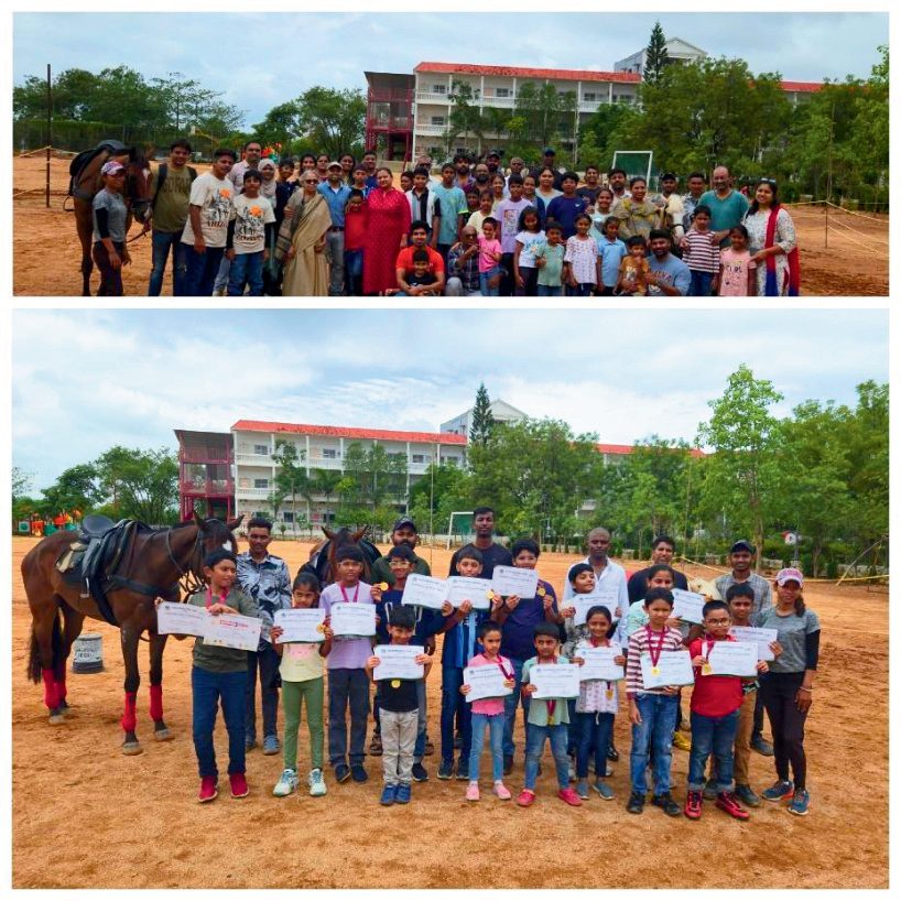 Large group photo of students, trainers, and staff at a school session